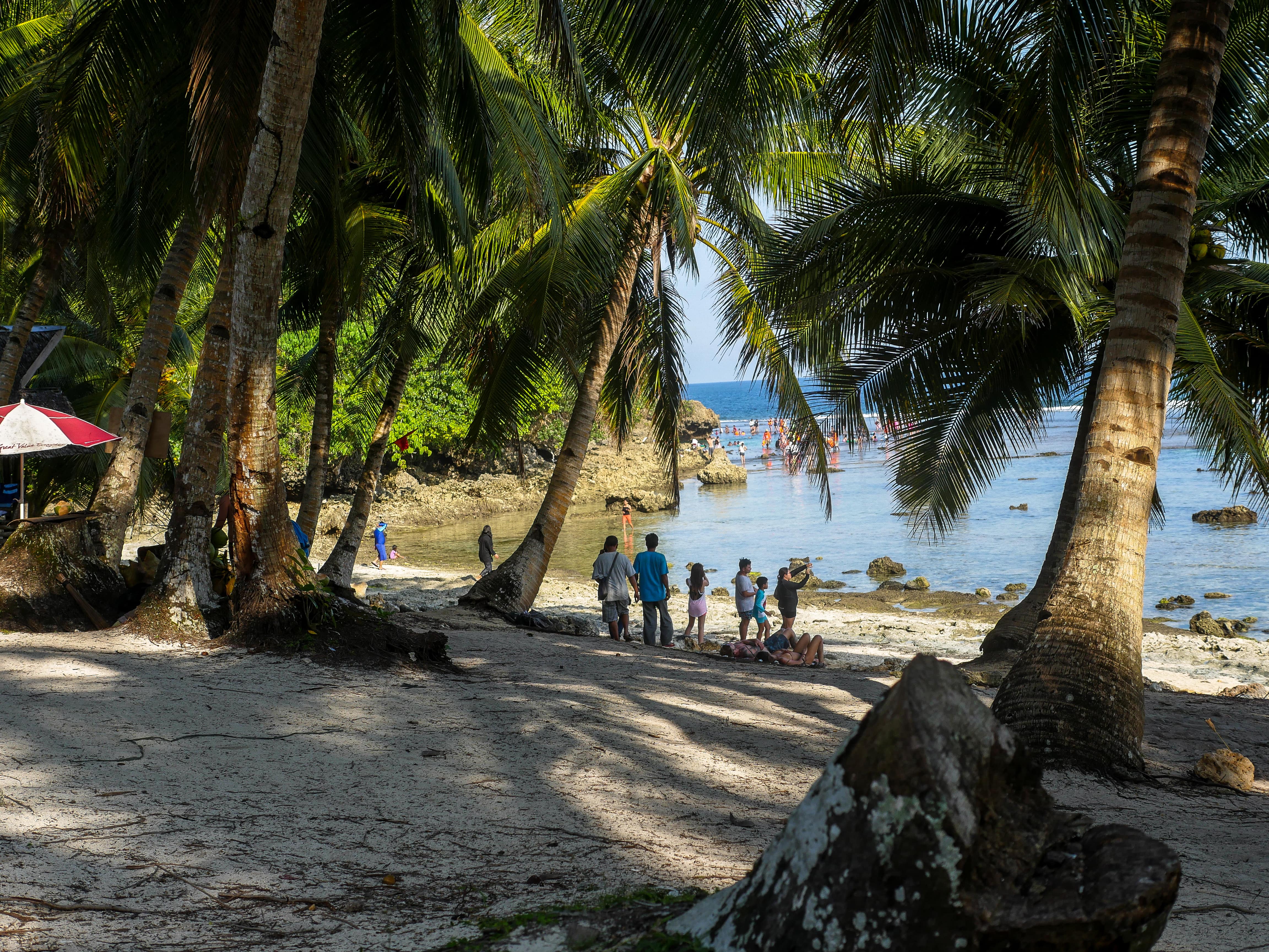 people at magpupungko beach and rock pools in siargao island